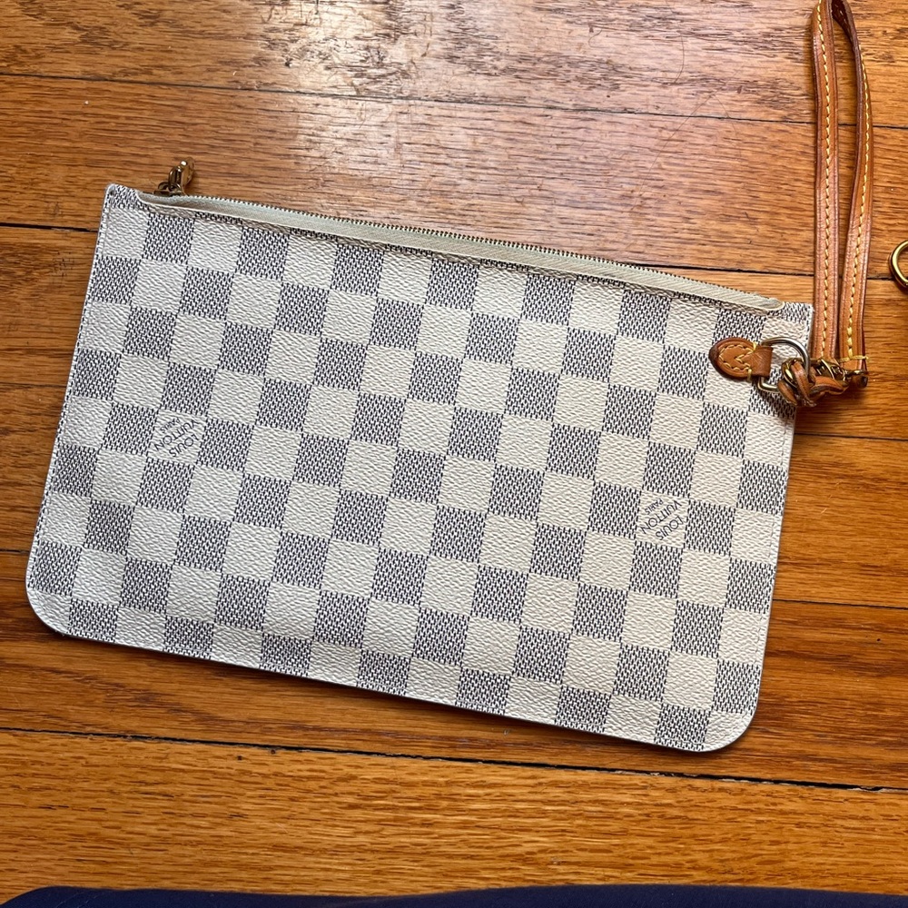 Louis Vuitton neverfull pouch.